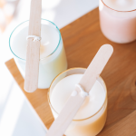Why We Choose Soy Wax for Every Candle We Make candles curing on a wooden table.