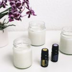 How Fragrance Can Change Your Mood and Transform Your Space A serene setup with candles, essential oils, and orchids creating a calming ambiance.